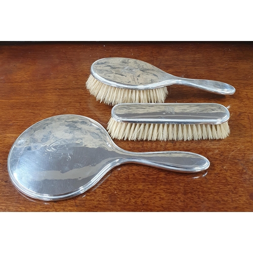 780 - A cased Birmingham Silver dressing table set dated 1922.