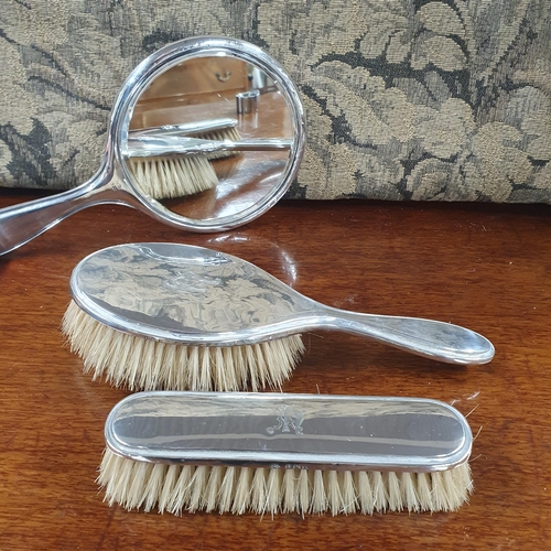 780 - A cased Birmingham Silver dressing table set dated 1922.