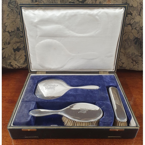 780 - A cased Birmingham Silver dressing table set dated 1922.