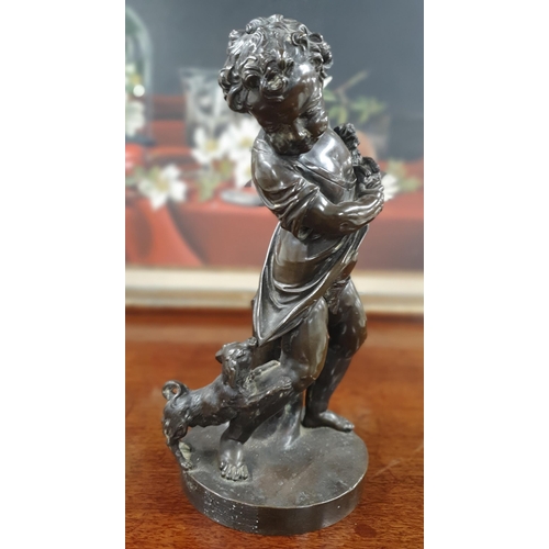 790 - A good well carved Bronze Figure of a young Child with a dog pulling at her skirt. No apparent signa... 