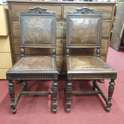 956 - A good pair of 19th Century Walnut showframe Hall Chairs with leather backs and seats and studded ou... 