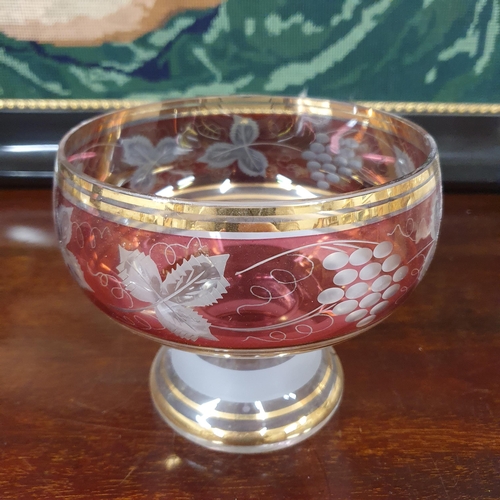 982 - A good pair of early 20th Century hand painted Vases along with a cranberry style centre bowl.
H 21 ... 