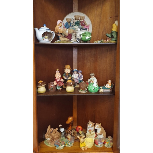 989 - A large quantity of Decorative Items on three shelves.