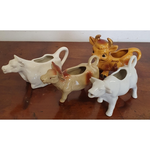 1004 - A group of Creamers. TB 11 cm approx.