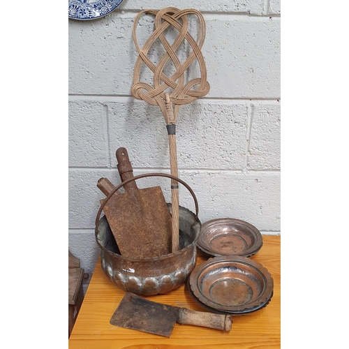 1104 - A quantity of vintage Items to include a copper cauldron, copper plates and vintage tools etc.