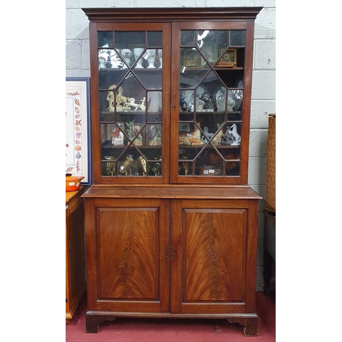 1110 - A good early 19th Century Mahogany two door Display Cabinet with twin raised and fielded base panel ... 