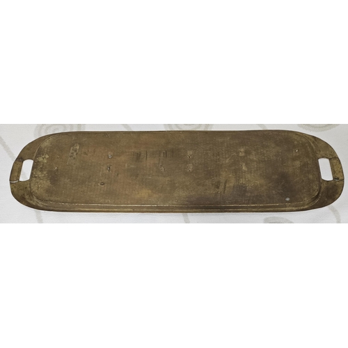 196 - An unusual 19th early 20th Century hammered Brass centre Tray in oblong form, 77 x 22 cms approx.