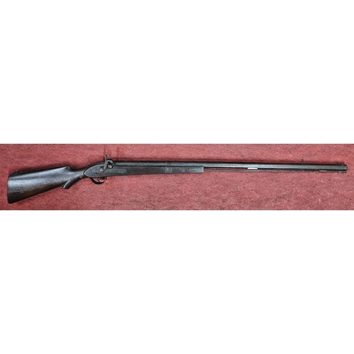 206 - An 18th Century - early 19th Century flint lock long barreled rifle, total length 135 cm approx.