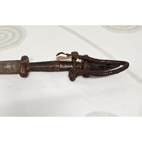 270 - A 19th early 20th Century long bladed Dagger with leather handle. 69 cm long approx.