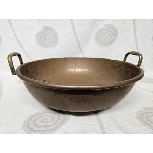 399 - A good 19th Century Copper Jam Pan with lifting handles. 44 cm diam.