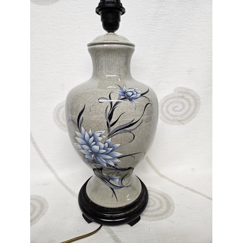 694 - A good Bulbous table Lamp with gray ground, hand painted floral decoration and crackle glaze.
H 45 c... 