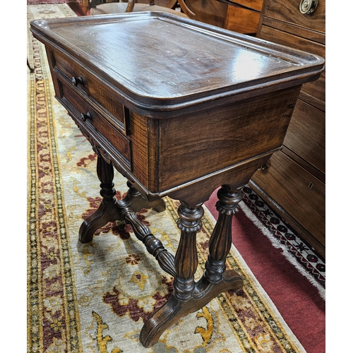 65 - A unusual 19th Century Walnut and grained twin drawer work Table with stretcher base.
65 x 36 x 59 c... 