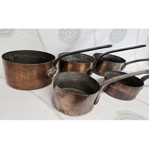 67 - A good set of graduated 19th Century Copper Saucepans with cast Iron handles. LB D 21 cm approx.