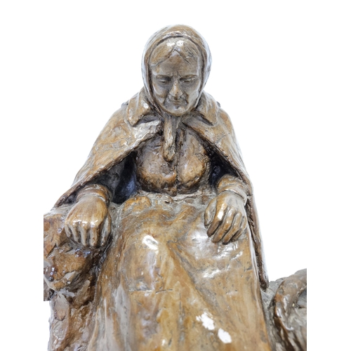 70 - A lovely and well sculpted figure of an elderly woman by F Trinque. Signature LL.