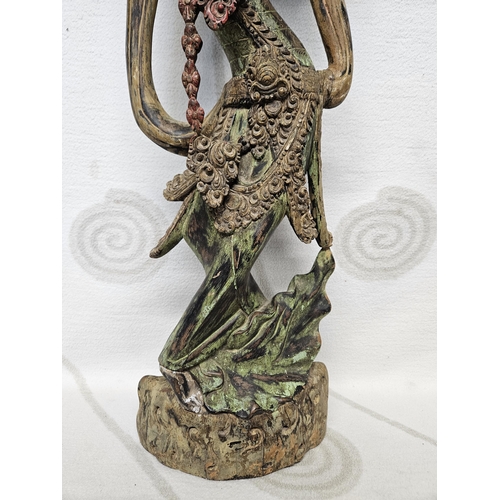 79 - A lovely Hardwood figure of an Oriental woman in period dress. 68 cm tall approx.