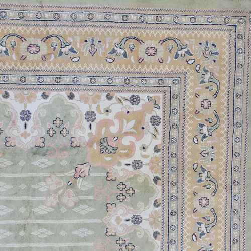 712 - A very large Belgian green ground Carpet with a large central medallion design.
L 340 x W 220 cm app... 