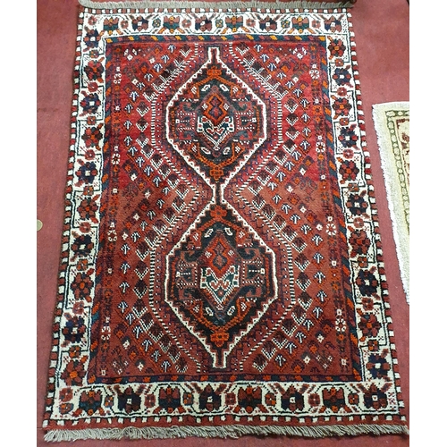 720 - A hand woven full pile Persian Shiraz Village Rug with a central medallion design.