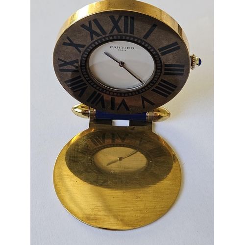 299A - A Fabulous Cartier folding travel Clock in a Gold plated Case with Blue Lapis hinge and winder, also... 