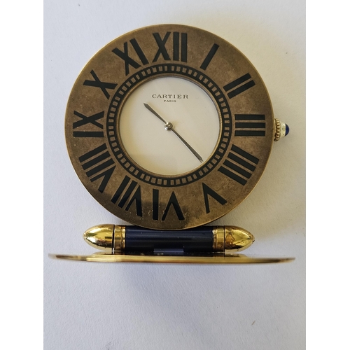 299A - A Fabulous Cartier folding travel Clock in a Gold plated Case with Blue Lapis hinge and winder, also... 