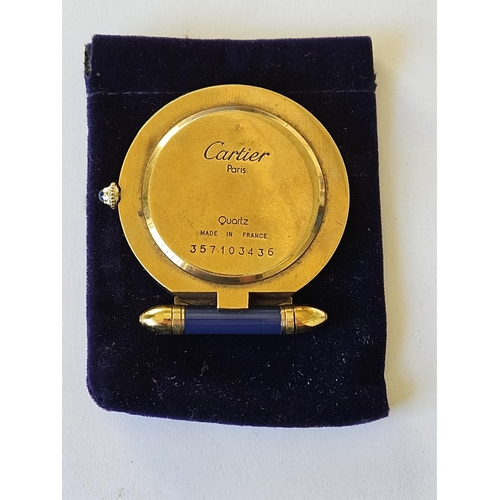 299A - A Fabulous Cartier folding travel Clock in a Gold plated Case with Blue Lapis hinge and winder, also... 