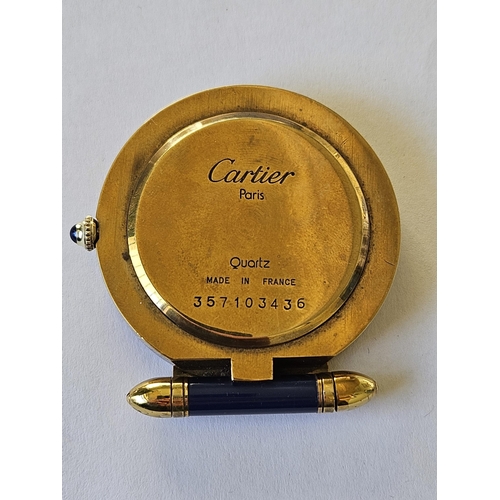 299A - A Fabulous Cartier folding travel Clock in a Gold plated Case with Blue Lapis hinge and winder, also... 