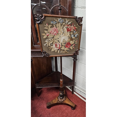 894 - A Regency Rosewood Pole Screen with tapestry upholstered centre. H 138 cm approx.