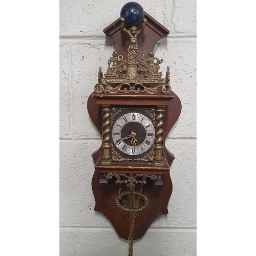 898 - Two wall mounted chain driven Clocks with weights.