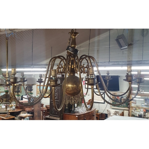 717 - A pair of large Brass Chandeliers.