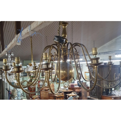 717 - A pair of large Brass Chandeliers.