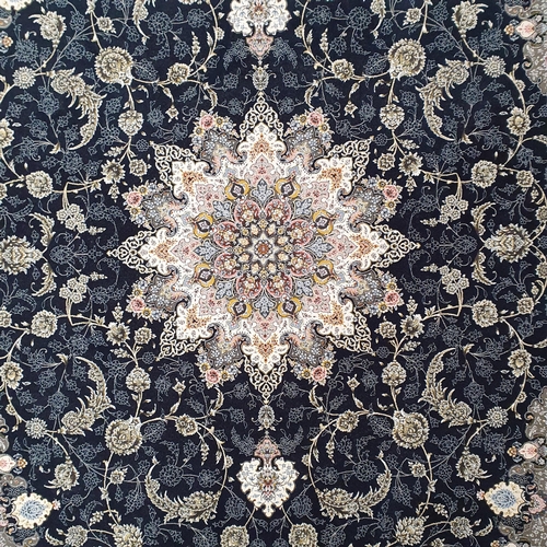 718 - A full pile hand woven Iranian Rug with an embossed floral medallion design.
L 240 x W 152 cm approx... 