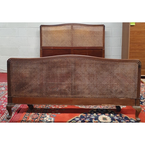 1451 - A late 19th early 20th Century Mahogany framed Bed with canework detail and moulded showframe outlin... 