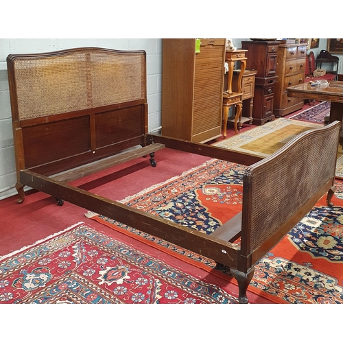 1451 - A late 19th early 20th Century Mahogany framed Bed with canework detail and moulded showframe outlin... 