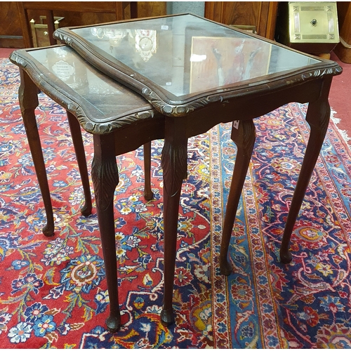 777 - A Mahogany square Supper Table. 48 x 48 x H 60 cm approx. Along with a nest of two Mahogany glass to... 