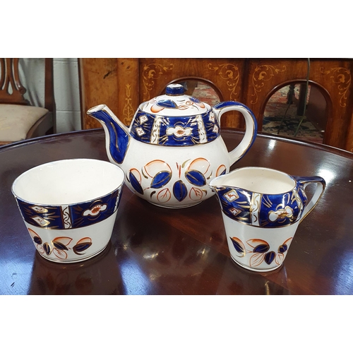 572 - A 19th Century Royal Winterton Teapot, Milk and Sugar set.