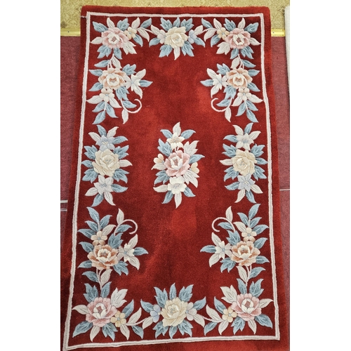 612 - A good pair of red ground Chinese Rugs with floral design. 152 x 90 cm approx.