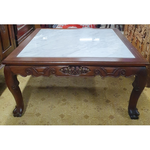 742 - A reproduction Oriental Rosewood marble topped coffee Table with highly carved frieze.
85 x 85 x H 4... 