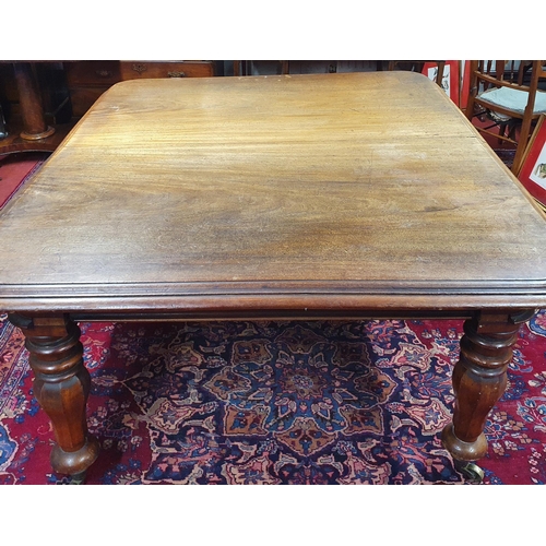 692 - A Victorian Mahogany Dining Table on tulip and octagonal supports with brass castors.H 73 x L 159 x ... 