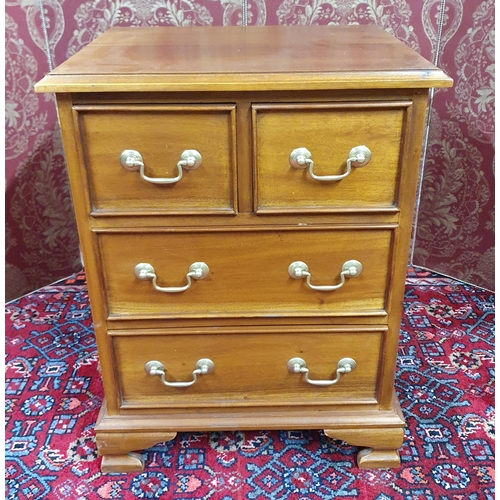 707 - A reproduction Mahogany miniature Chest of Drawers. H 66 x W 50 x D 40 cm approx. Shed 2.