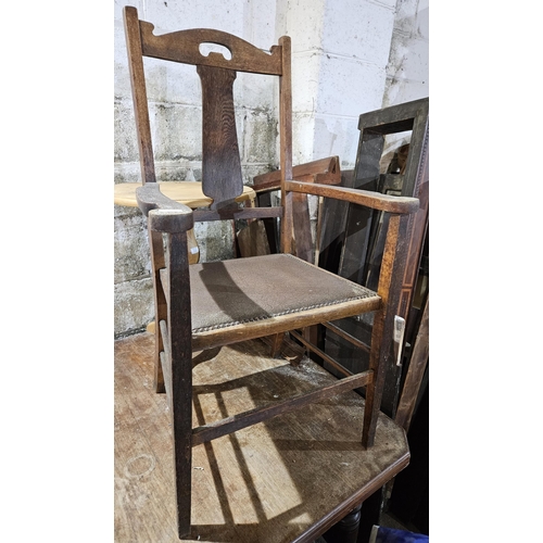 557 - A late 19th Century Oak Armchair. Held in Old Workshop.