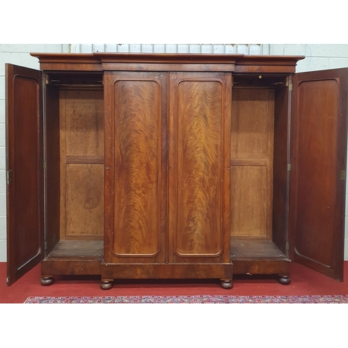 182 - A large 19th Century four door breakfront Wardrobe with flame grain panel doors.
229 x 60 x H 199 cm... 