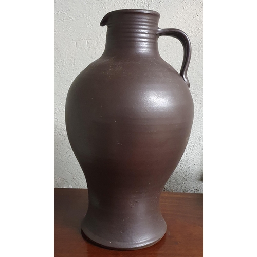 20 - A 19th Century floral pattern Jug along with a large stoneware Ewer. TB 40 cm approx.