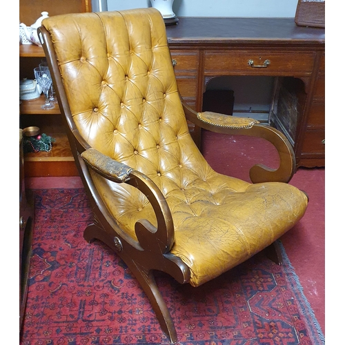 38 - A 20th Century Mahogany Chesterfield style easy Armchair with deep buttoned back. W 64 cm approx.