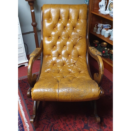 39 - A 20th Century Mahogany Chesterfield style easy rocking Chair with deep buttoned back. W 66 cm appro... 