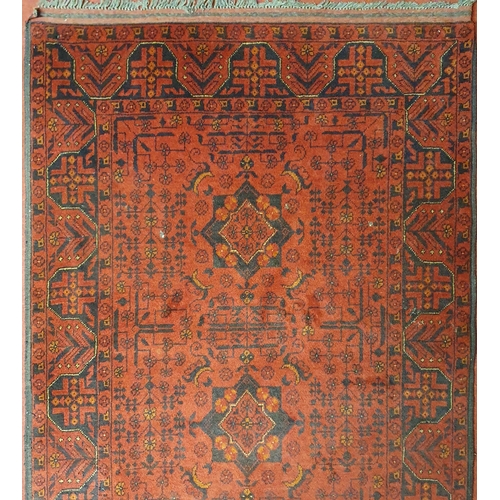 45 - A red ground Persian Rug with unique centre medallion style. 110 x 160 cm approx.