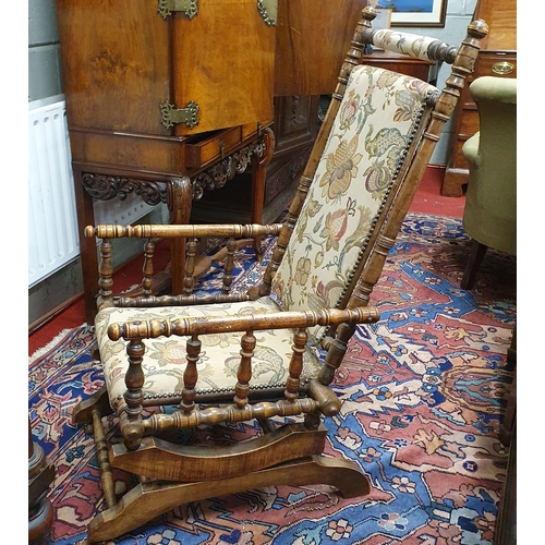 67 - A 19th Century American style rocking chair with bobbin style outline. 55 x SH 37 x BH 107 cm approx... 