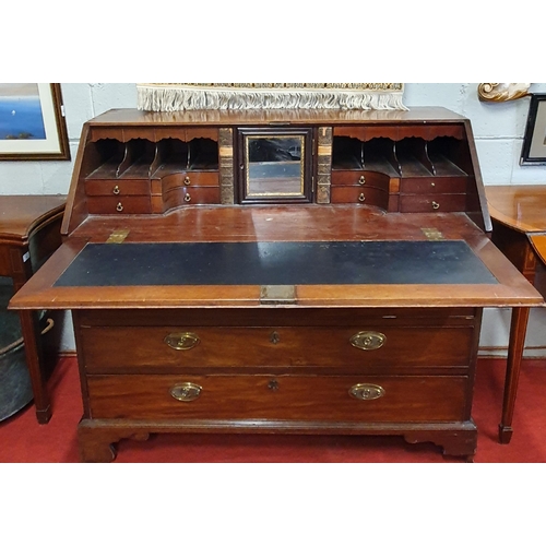 77 - A Georgian Mahogany Bureau with highly fitted pigeon hole Interior, Brass oval handles.
121 x 58 x H... 