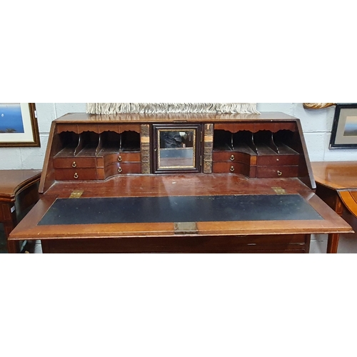 77 - A Georgian Mahogany Bureau with highly fitted pigeon hole Interior, Brass oval handles.
121 x 58 x H... 