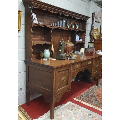 224 - 19th Century Oak dresser and rack, the rack with moulded cornice over shaped valance and shelving, t... 