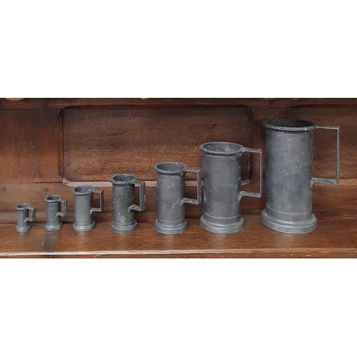 235 - A good set of seven 19th Century Pewter Measures. Largest being D 10 x H 19 cm approx.