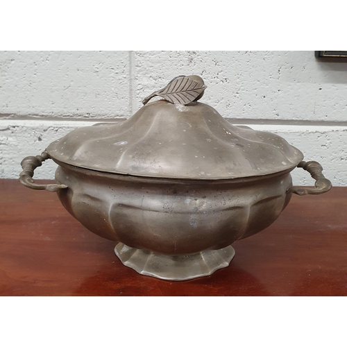 285 - A 19th Century Pewter centre Dish and Tray. 
33 x 22 x 22 cm approx.